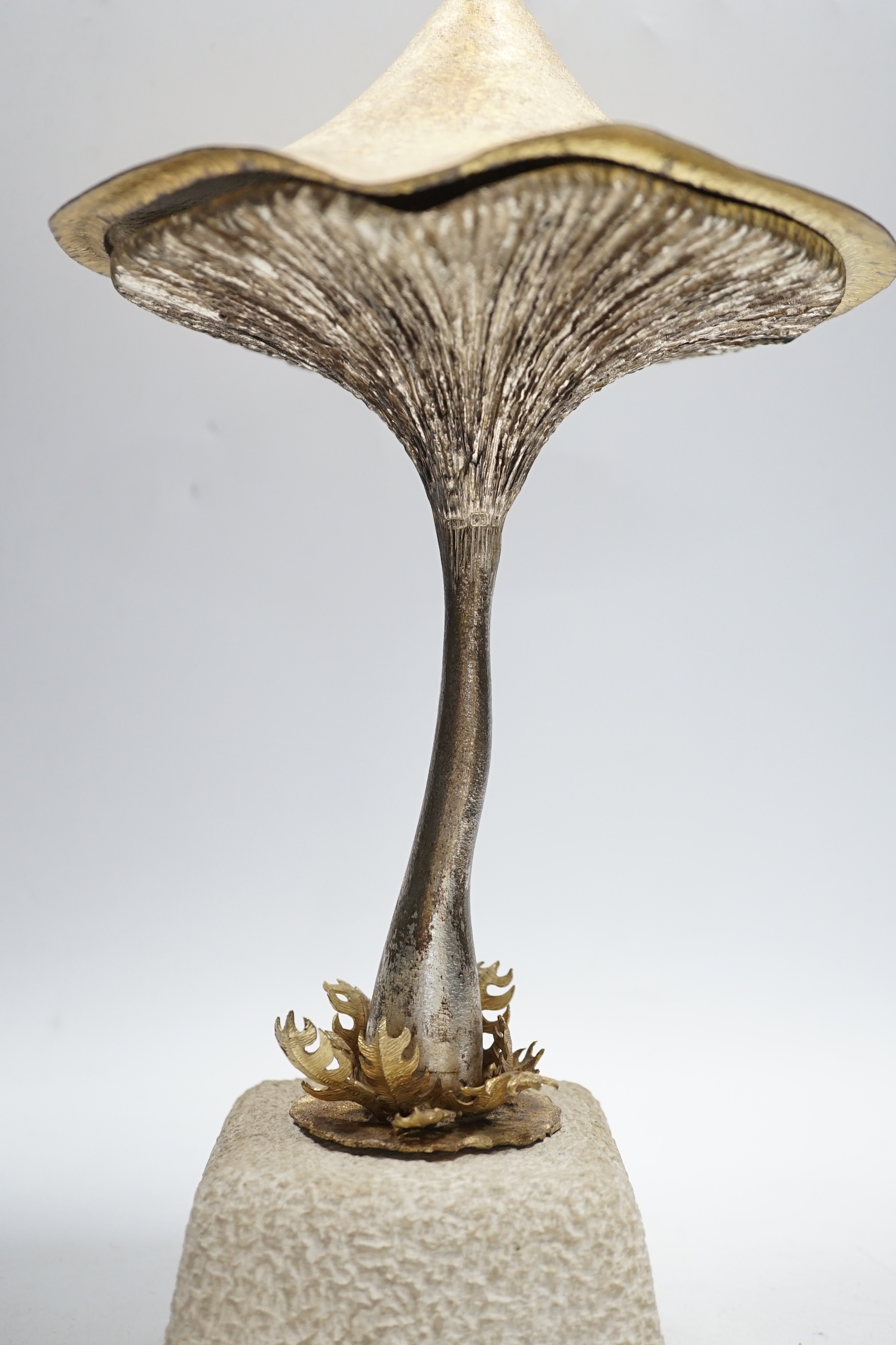 An Elizabeth II limited edition novelty surprise mushroom, by Christopher Nigel Lawrence, London, 1976, opening to reveal a pixie fishing, no.2/8, on a simulated rock base, overall height 29.5cm, with certificate.